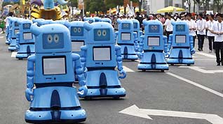Haibao robots march in the Shanghai Expo Park, June 1, 2010. A total of 20 Expo mascot robots made up a team to walk in the Expo Park as Children's Day was celebrated there, attracting lots of visitors.