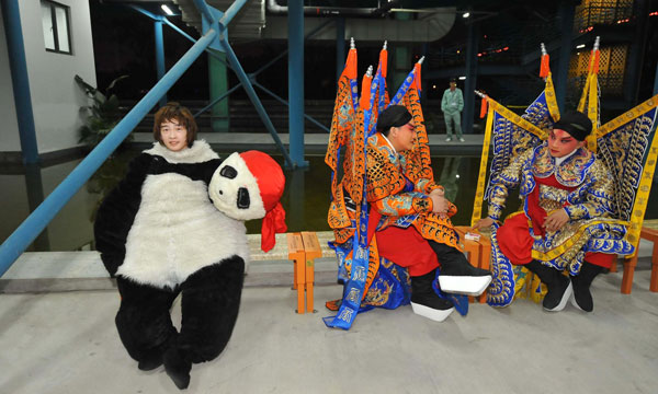 18-year-old Sun Cheng, 'Kung Fu Panda', takes a rest after a show at the Shanghai Expo Park.