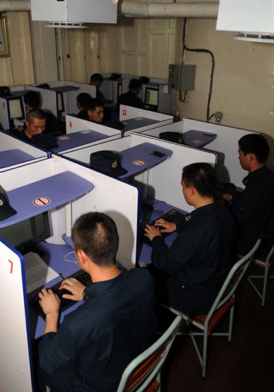 Telegraphists of China's fifth escort flotilla to the Gulf of Aden attend a competition during a communications training in the west of the Gulf of Aden June 3, 2010. 