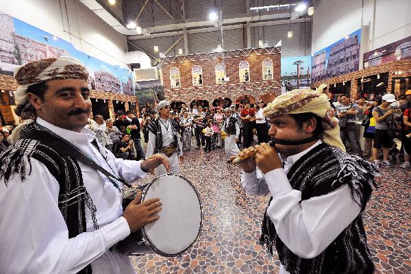 Yemeni performers dance along the drumbeat in Yemen Pavilion during the 2010 World Expo in Shanghai, east China, June 2, 2010. 