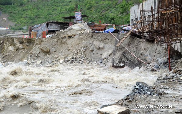 The No. 213 National Highway in southwest China's Sichuan Province, commonly known as the 'lifeline' for reconstruction in the mountainous quake zone, is blocked after floods in Maoxian County, Sichuan Province, on June 8, 2010. 