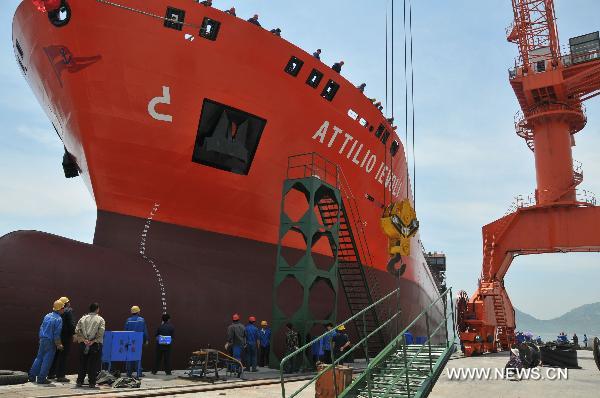Photo taken on June 8, 2010 shows the colossal chemicals-transport ship of Attilio Ievoli, which is manufactured by the Rushan Shipbuilding Co., Ltd. for export to Italy, taking water at its launching ceremony, at Rushan, east China's Shandong Province. 