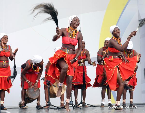 Actresses of a Namibian performance troupe perform folk dance at Africa Square in the World Expo park in Shanghai, east China, on June 10, 2010. 