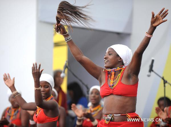 Actresses of a Namibian performance troupe perform folk dance at Africa Square in the World Expo park in Shanghai, east China, on June 10, 2010. 
