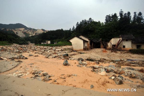 Photo taken on June 16, 2010 shows the farmers' houses in messy ruins after a destructive mudslide ravaged past, at Fushe Village, Yetan Town of Dongyuan County, south China's Guangdong Province.