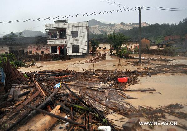 Photo taken on June 16, 2010 shows the farmers' houses in messy ruins after a destructive mudslide ravaged past, at Fushe Village, Yetan Town of Dongyuan County, south China's Guangdong Province.