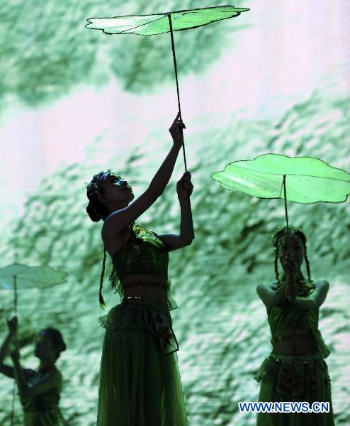 Performers from east China's Jiangsu Province perform dance in Shanghai, east China, June 17, 2010. 