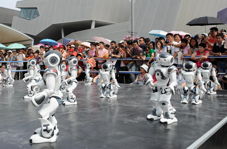 A squad of robots dances at the France Pavilion on June 21, the France National Pavilion Day at Shanghai Expo Park. 