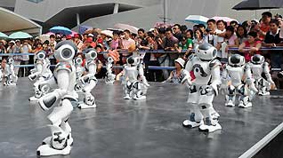 A squad of robots dances at the France Pavilion on June 21, the France National Pavilion Day at Shanghai Expo Park.