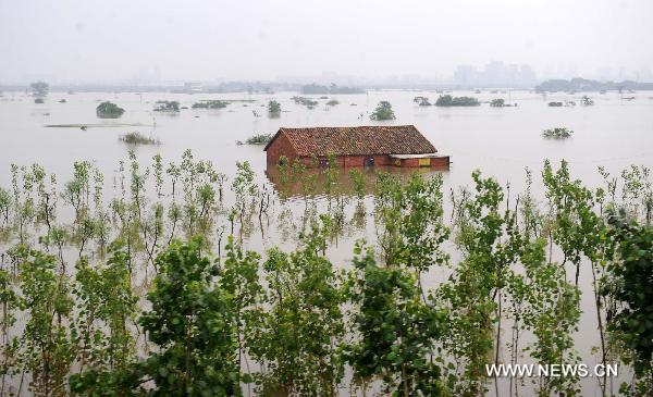 Luozhen town falls into a vast expanse of water, June 22, 2010.