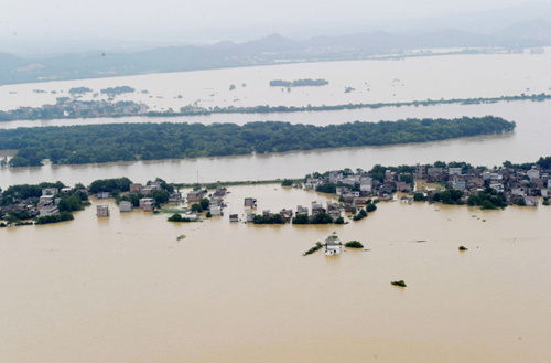 Photo taken on June 22, 2010 shows a flooded village in Fuzhou, Jiangxi Province. 