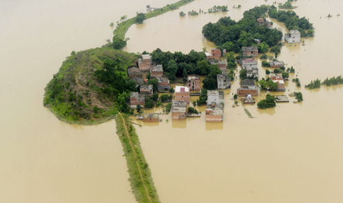 Photo taken on June 22, 2010 shows a flooded village in Fuzhou, Jiangxi Province. 