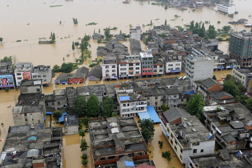 Photo taken on June 22, 2010 shows a flooded village in Fuzhou, Jiangxi Province. 