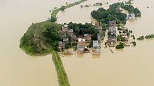 Photo taken on June 22, 2010 shows a flooded village in Fuzhou, Jiangxi Province.