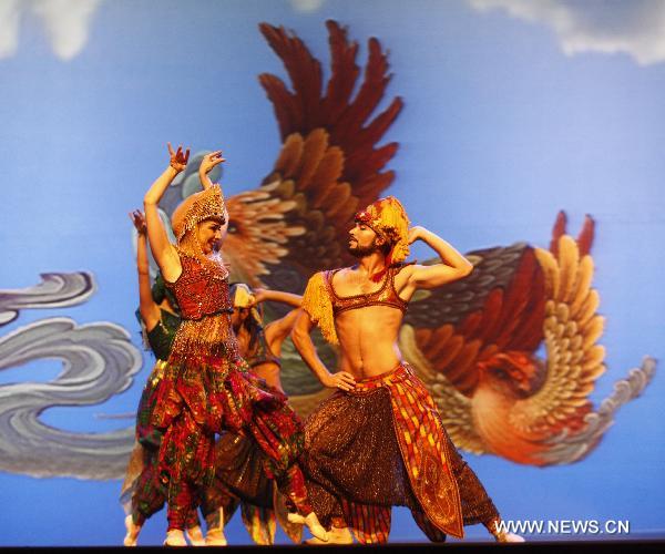 Performers of the Caracalla Dance Theatre dance to celebrate the National Pavilion Day of Lebanon in the World Expo Park in Shanghai, east China, on June 22, 2010. 