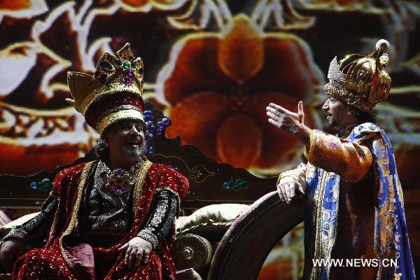 Performers of the Caracalla Dance Theatre dance to celebrate the National Pavilion Day of Lebanon in the World Expo Park in Shanghai, east China, on June 22, 2010. 