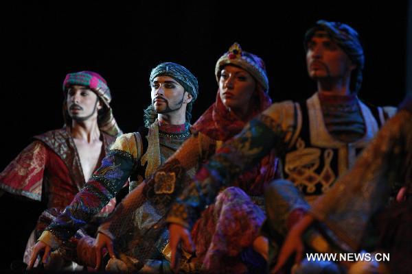 Performers of the Caracalla Dance Theatre dance to celebrate the National Pavilion Day of Lebanon in the World Expo Park in Shanghai, east China, on June 22, 2010. 