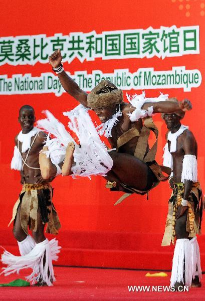 Actors from Mozambique perform tradional dance during the national pavilion day of the Mozambique pavilion at the World Expo in Shanghai, east China, on June 25, 2010. 