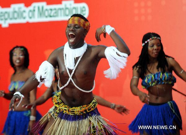 Actors from Mozambique perform tradional dance during the national pavilion day of the Mozambique pavilion at the World Expo in Shanghai, east China, on June 25, 2010. 