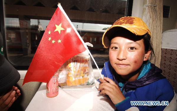 Qunying Songmao, a student of a middle school from quake-hit Yushu Tibetan Autonomous Prefecture, sits on the train fron Xining to Chengdu, June 27, 2010.