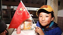 Qunying Songmao, a student of a middle school from quake-hit Yushu Tibetan Autonomous Prefecture, sits on the train fron Xining to Chengdu, June 27, 2010.