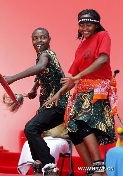 Artists perform during a ceremony marking the National Pavilion Day of Tanzania at the 2010 World Expo in Shanghai, east China, July 7, 2010.