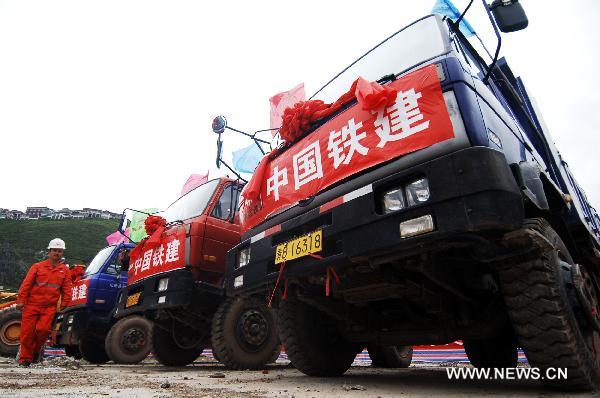 Vehicles are seen at the site where a foundation laying ceremony is held in Yushu, northwest China's Qinghai Province, July 10, 2010. 