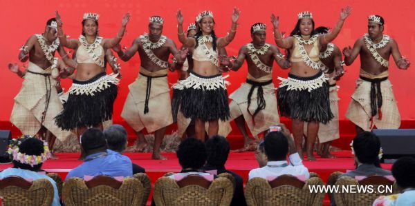Artists dance during an activity celebrationg the National Pavilion Day of Kiribati, at the 2010 World Expo in Shanghai, east China, July 12, 2010.