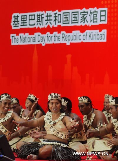 Artists dance during an activity celebrationg the National Pavilion Day of Kiribati, at the 2010 World Expo in Shanghai, east China, July 12, 2010.