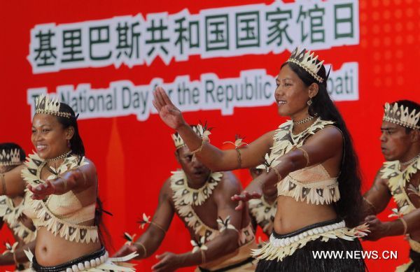 Artists dance during an activity celebrationg the National Pavilion Day of Kiribati, at the 2010 World Expo in Shanghai, east China, July 12, 2010.