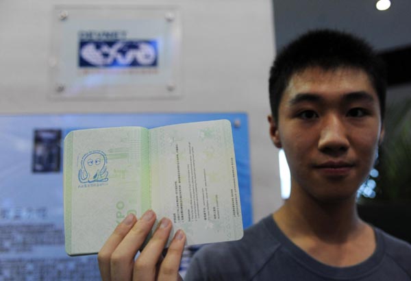 A visitor shows his Expo passport stamped with the 'octopus lucky seal' in the DEVNET Pavilion of Shanghai Expo, July 12, 2010.