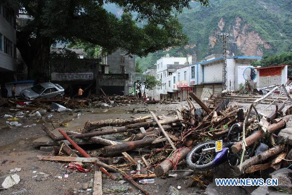 Photo taken on July 13, 2010 shows damaged houses after the ravage of flash floods in Xiaohe Township of Qiaojia County, Zhaotong City, southwest China's Yunnan Province.