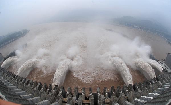 Flood waters are sluiced at the Three Gorges Dam in Yichang, central China's Hubei Province, July 19, 2010.