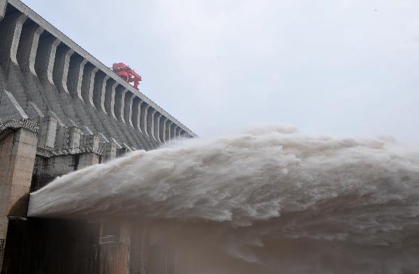 Flood waters are sluiced at the Three Gorges Dam in Yichang, central China's Hubei Province, July 19, 2010.