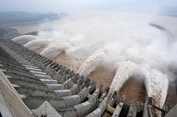 Flood waters are sluiced at the Three Gorges Dam in Yichang, central China's Hubei Province, July 19, 2010.