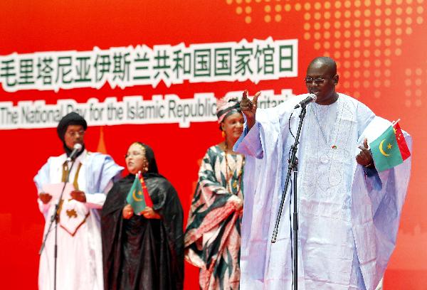 Actors perform during a ceremony to mark the National Pavilion Day for the Islamic Republic of Mauritania at the 2010 World Expo in shanghai, east China, July 19, 2010.