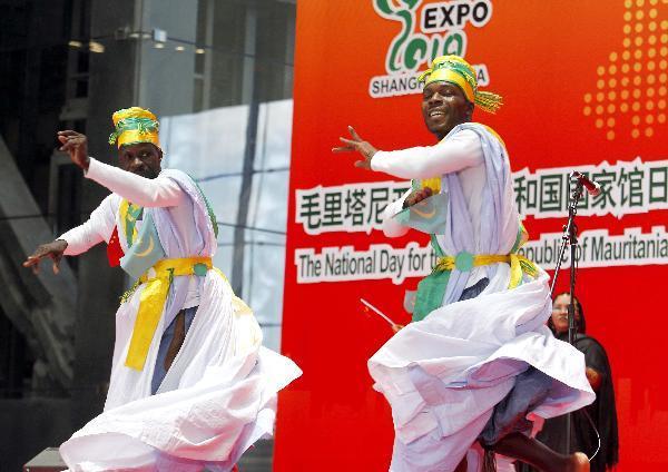 Actors perform during a ceremony to mark the National Pavilion Day for the Islamic Republic of Mauritania at the 2010 World Expo in shanghai, east China, July 19, 2010.