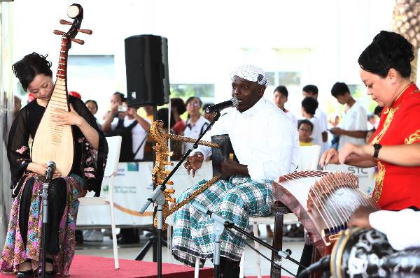 Artists from Saudi Arabia and China give a performance at the Saudi Arabia Pavilion in the Shanghai Expo Park on July 21, 2010. 