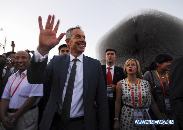 Former British Prime Minister Tony Blair (F) visits the Britain Pavilion at the World Expo Park in east China's Shanghai on July 27, 2010. 