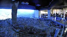 Tourists visit the Tangshan Earthquake Museum in Tangshan, north China's Hebei Province, July 28, 2010.