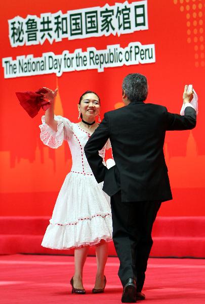 Peruvian actors perform during a ceremony celebrating the National Pavilion Day for the Republic of Peru, in the 2010 World Expo in Shanghai, east China, July 28, 2010. 