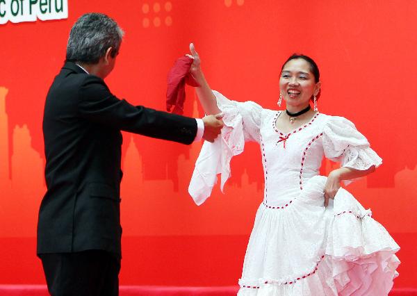 Peruvian actors perform during a ceremony celebrating the National Pavilion Day for the Republic of Peru, in the 2010 World Expo in Shanghai, east China, July 28, 2010.