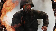 A soldier jumps over a fire obstacle during a psychological training at an army training field in Guangzhou, capital of south China's Guangdong Province, July 28, 2010, before the coming 83rd anniversary of the founding of the People's Liberation Army (PLA) which falls on August 1.
