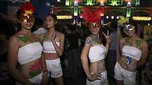 Models pose for photos at the 12th China International Beer Festival in Dalian, northeast China's Liaoning Province, July 29, 2010.