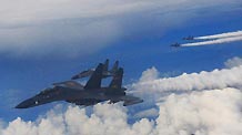 Warplanes fly during a military drill held by Air Force of the Guangzhou Military Area Command of the People's Liberation Army (PLA) based in Guangzhou, capital of south China's Guangdong Province, July 29, 2010.