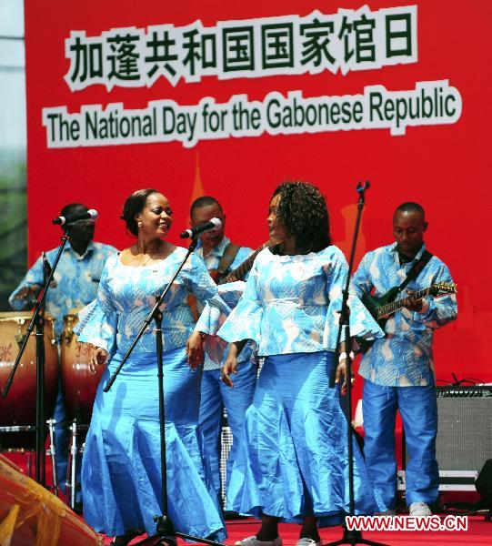 Gabonese actors perform at the ceremony celebrating the National Pavilion Day for the Gabonese Republic, in the 2010 World Expo in Shanghai, east China, July 30, 2010. 
