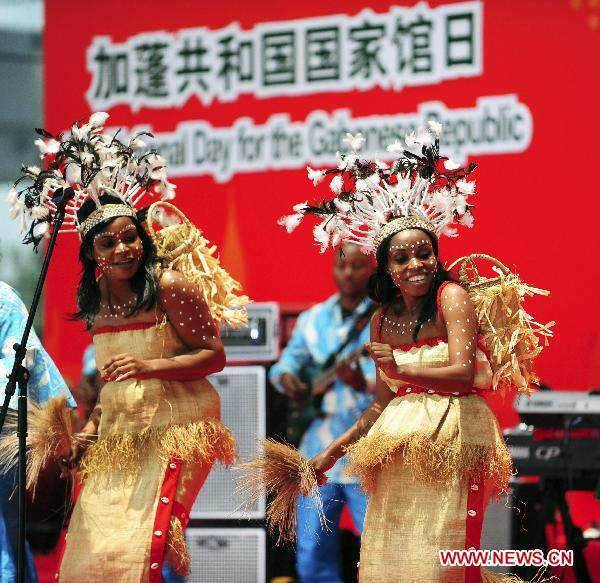 Gabonese actors perform at the ceremony celebrating the National Pavilion Day for the Gabonese Republic, in the 2010 World Expo in Shanghai, east China, July 30, 2010. 