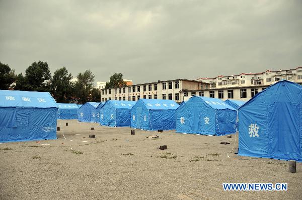 Temporary tents are set up at a relocation place in Baishan County, northeast China's Jilin Province, Aug. 5, 2010. 