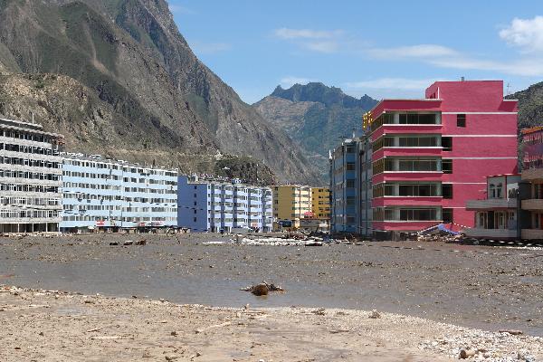 Buildings and roads are hit by mudslides in Zhouqu County, Gannan Tibetan Autonomous Prefecture in northwest China's Gansu Province, Aug. 8, 2010. 