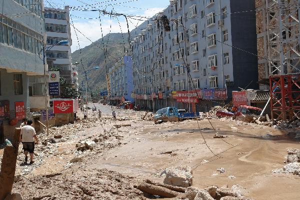 Photo taken on Aug. 8, 2010 shows buildings, vehicles and roads hit by mudslides in Zhouqu County, Gannan Tibetan Autonomous Prefecture in northwest China's Gansu Province. 